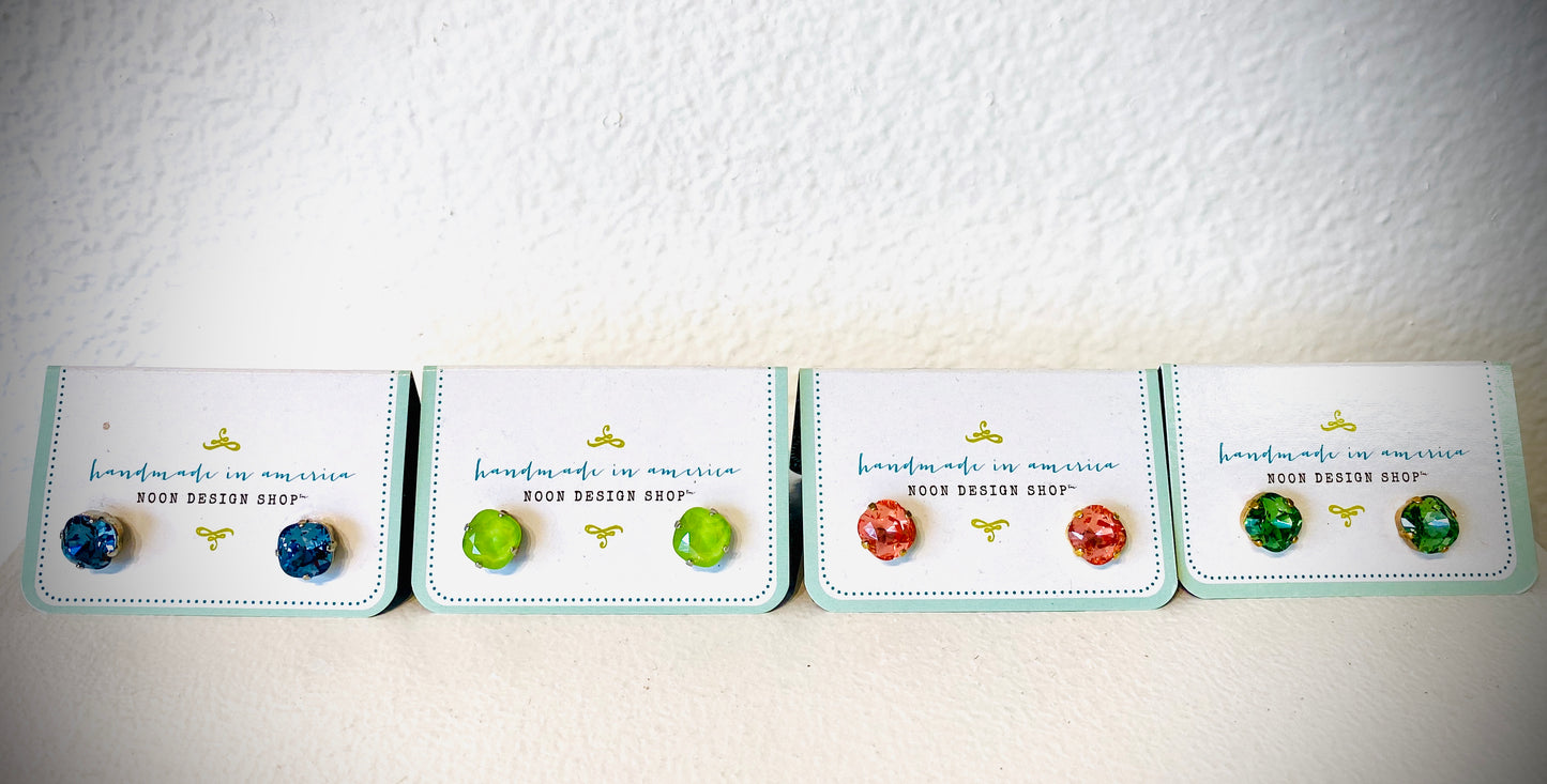 These gorgeous earrings are hand made in America. These sparkling pieces come in a variety of four colors: blue, pink, green and lime.