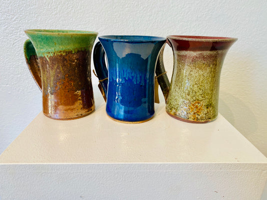 This beautiful pottery-crafter coffee mug touts lots of texture and lots of color to brighten your day with a wide selection of colors and finishes.
