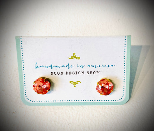 These gorgeous earrings are hand made in America. These sparkling pieces come in a variety of four colors: blue, pink, green and lime. 